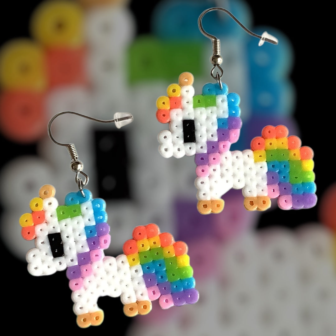 Handmade fuse bead earrings featuring pixel-style baby unicorn design with nickel-free hook findings on kraft card backing