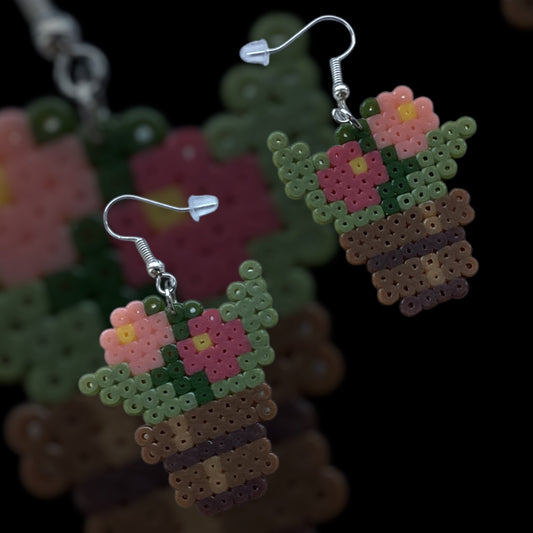 Handmade floral fuse bead earrings shaped like flower pots with silver-tone hooks shown on matching backing image”