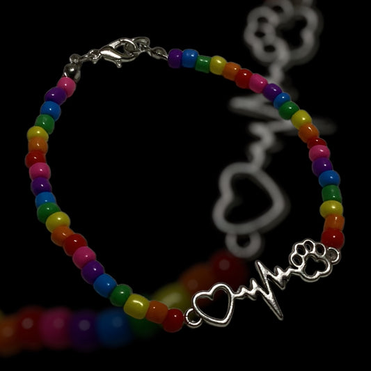 “Rainbow beaded bracelet with heartbeat and paw charm”

“Pet memorial bracelet with silver clasp and charm”

“Non-stretch bracelet for pet lovers with colourful beads”