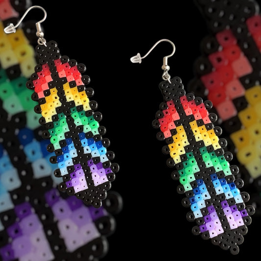 Handmade fuse bead earrings featuring rainbow pixel-style feather design with nickel-free hook findings on kraft card backing